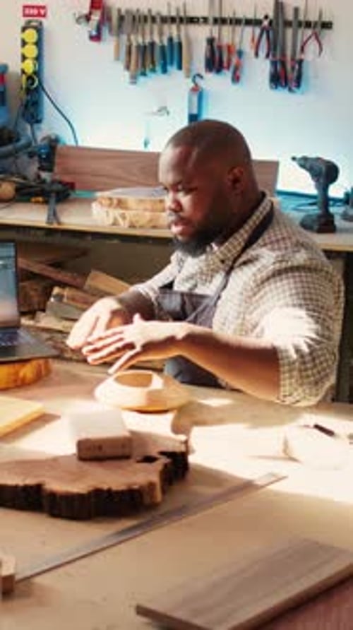 Vertical Video Woodworkers Designing Custom 3D Furniture on Notebook in Studio