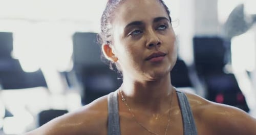 4k footage of a woman looking exhausted after her workout at the gym