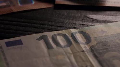 Close Up Shot of Person Identity Document Money Euro Banknotes Euro Bills Scattered on the Table and