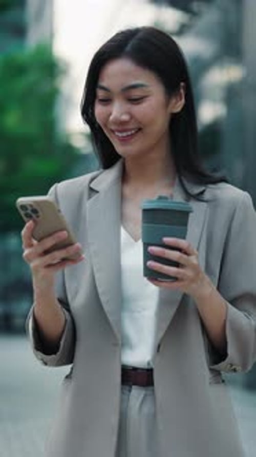 Portrait of Thai Businesswoman with Coffee Cup Typing Message