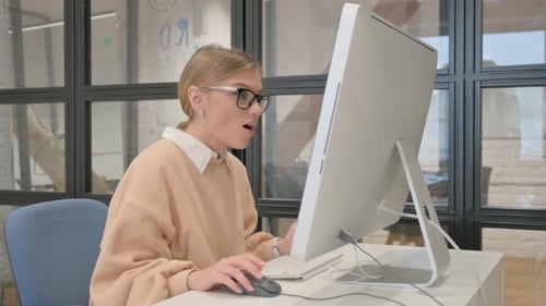 Successful Woman Working at Computer in Modern Office