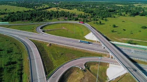 Transport Interchange on the Highway Aerial of Cars Drive Along the Highway Outside the City