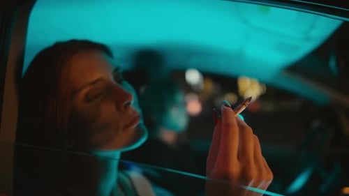 woman smoking cigarette in car Woman Smoking Cigarette in Car at Night woman smoking cigarette in car Woman Smoking Cigarette in Car at Night