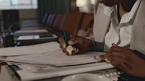 Woman Highlighting Text in Conference Room