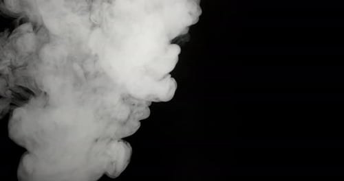 Billowing White Smoke Rising on Black Background
