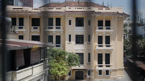 Facade and Roof of the Art Gallery Through the Bars of a City Building
