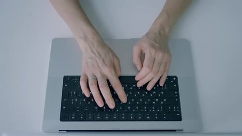 Hands Typing on Keyboard Action Top View of Hands Typing on Laptop Keyboard Person is Typing on New
