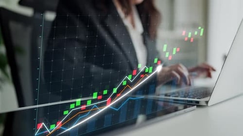 Business professional analyzing stock market trends on laptop with digital graphs and charts in mode