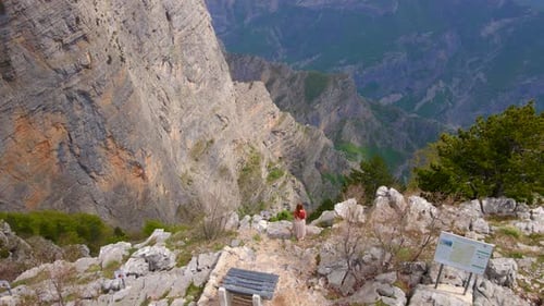 Aerial Video of a Young Woman Tourist Visitng the Grlo Sokolovo Canyon