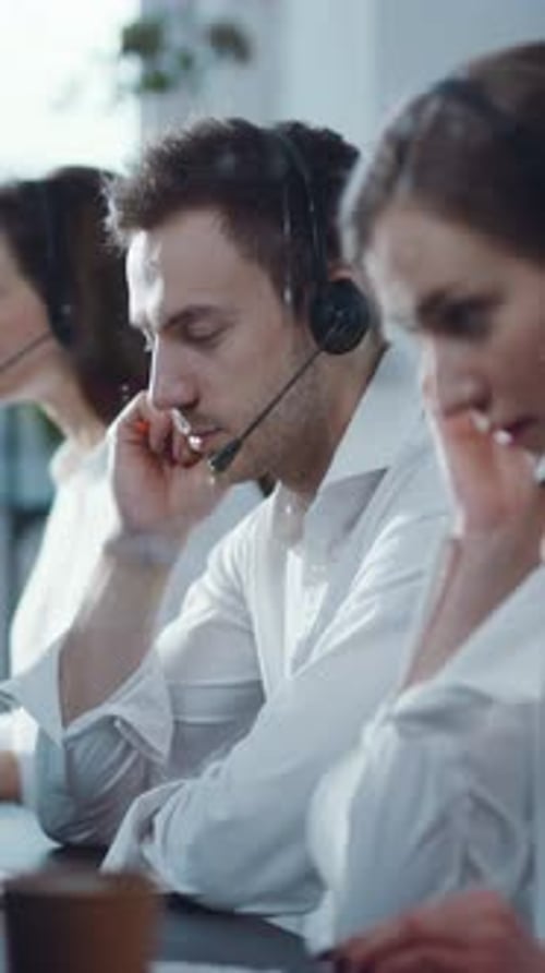 Dedicated and Focused Customer Service Representatives Working Effectively in a Modern Office