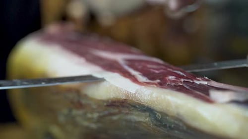 Jamon Sliced and Plated with Knife and Tongs