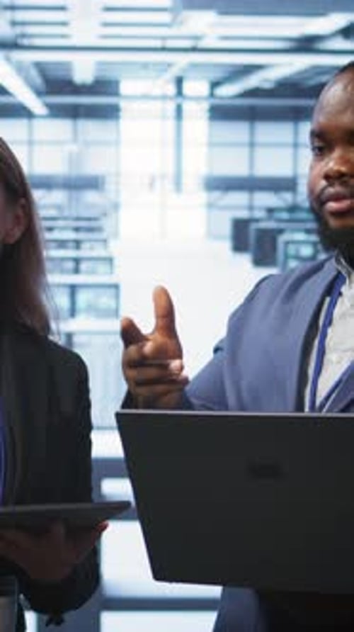 Vertical Video Teamworking Colleagues Doing Checkup in Data Center