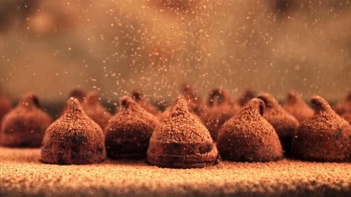 Chocolate Truffles with Falling Cocoa Powder