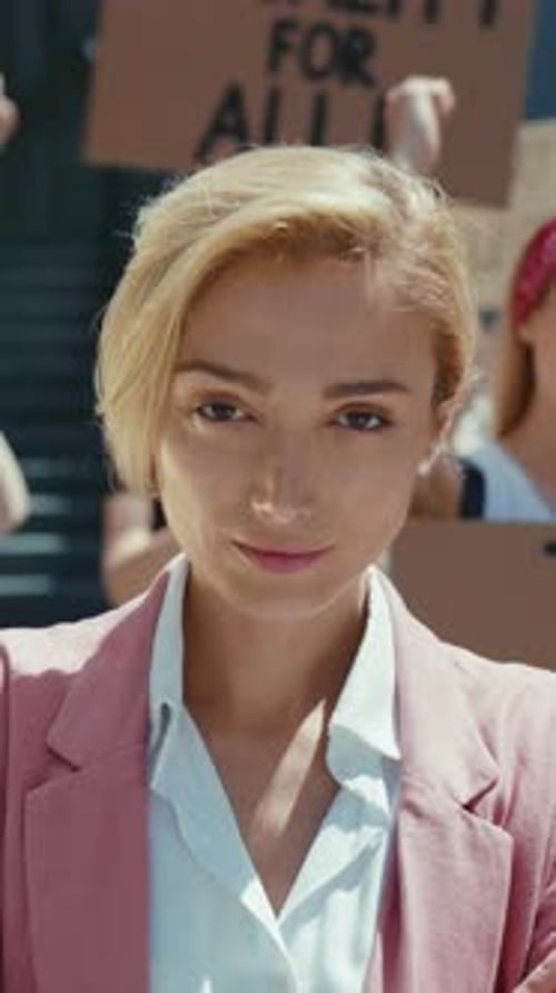 Woman in Crowd with Equality Signs