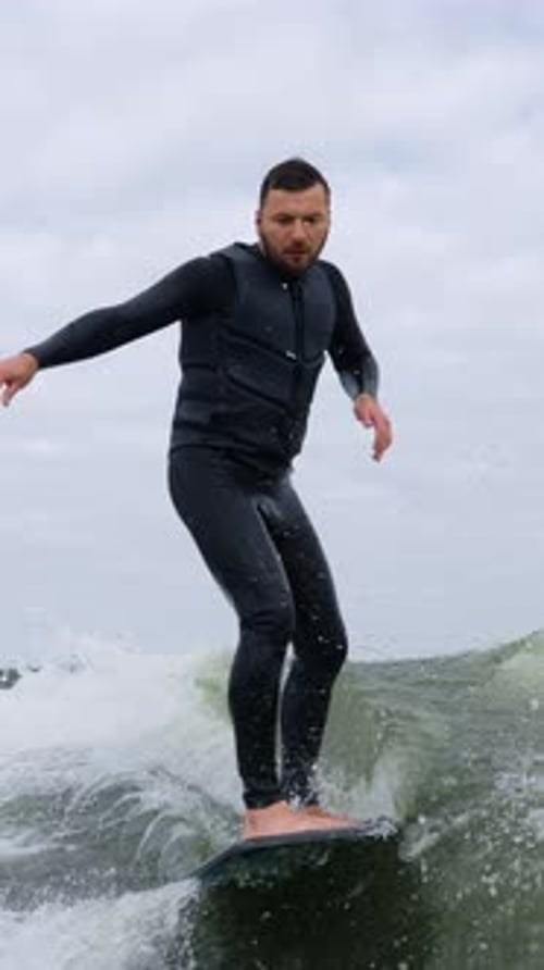 Man Wake Surfing on a Beautiful Overcast Day