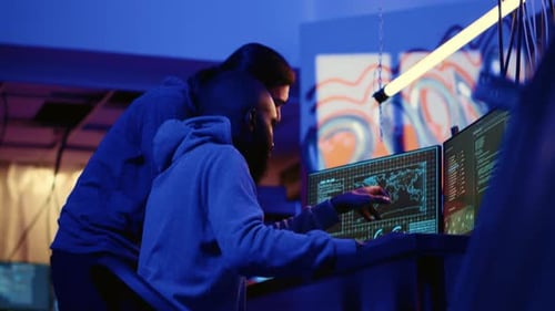 Data Experts Work at Night in Urban Office