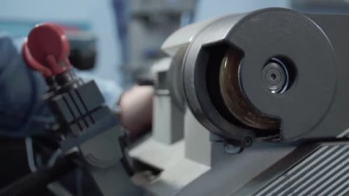 Hispanic man Security expert manipulating specialized in key duplication.