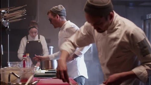 Team Working Together in Kitchen of Restaurant
