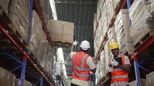 Logistics employees are working warehouse.