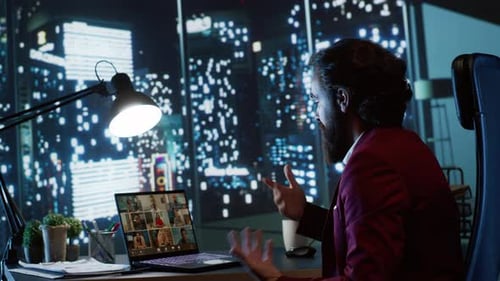 Man in Suit Talking on Video Call at Night