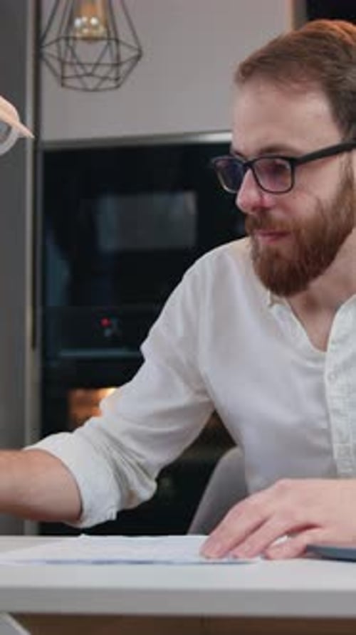 Handsome Caucasian Man Using Laptop Computer for Work in Home Office Business Male is Enjoying