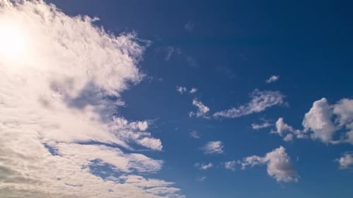 Time Lapse of Fluffy Clouds Drifting Across Blue Sky