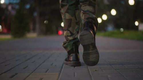 Marching Soldiers In Leather Boots Traverse City Pavement After Dark Rhythmic Footsteps Of Army