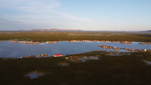 Drone shot of floating villages on Lake Titicaca in Peru.
