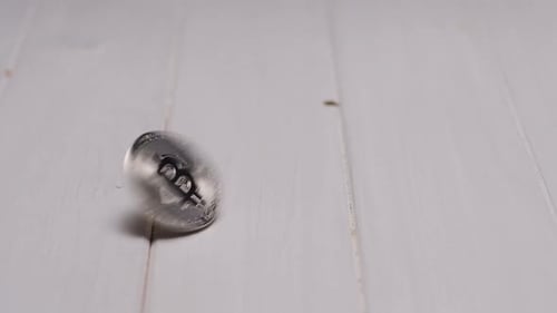 Close Up of Bitcoin Spinning on White Surface