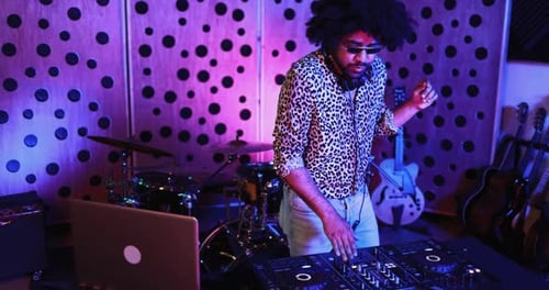African Dj Man Dancing While Mixing Music Inside Boutique Recording Studio African