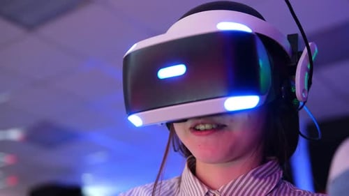 Teen Smiles Wearing Virtual Reality Headset