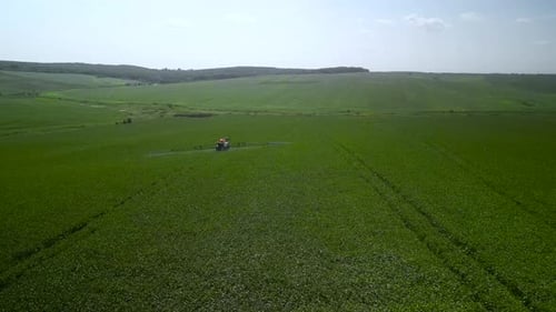 Spray Fertilize On Field With Chemicals In Agriculture Field