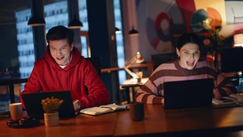 Emotional Team Rejoicing Achievement at Dark Office Coworking Space Closeup