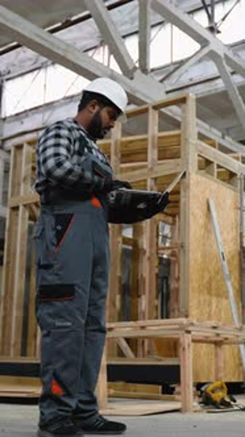 Indian Engineer Inspecting SIP Panel House Manufacturing
