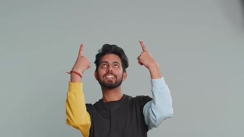 Indian Man Showing Thumbs Up Pointing Empty Place Advertising Area for Commercial Text Copy Space