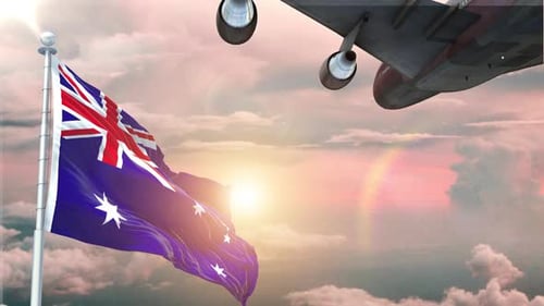 Die australische Flagge weht realistisch mit Flugzeug, das bei Sonnenaufgang abhebt