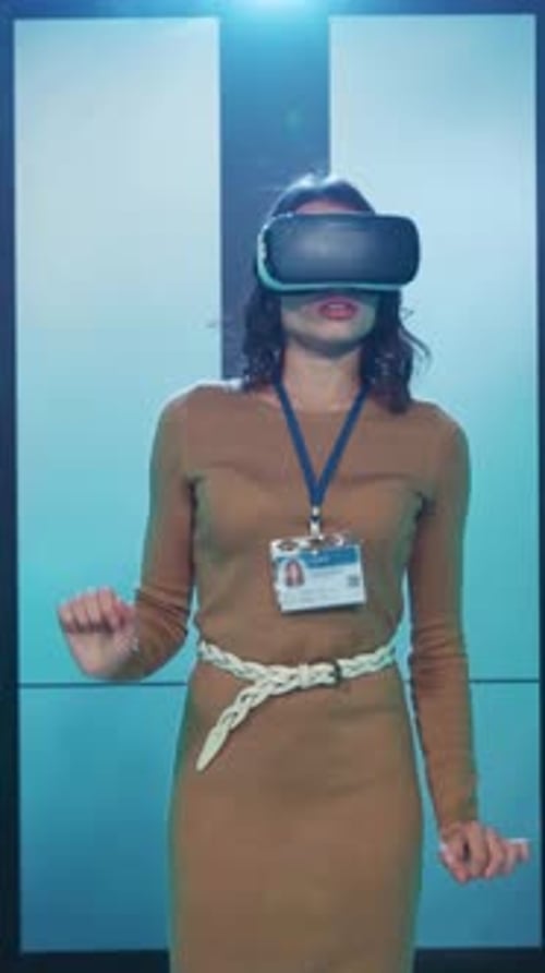 A Woman Uses a Virtual Reality Headset in a Modern Office Highlighting Tech in the Workplace