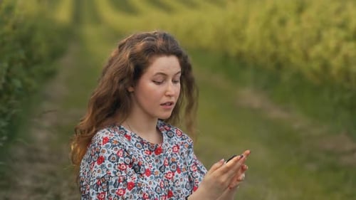Close-up of a woman applying hand spray on her palms