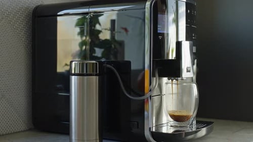 Coffee Machine Brewing Espresso in Kitchen