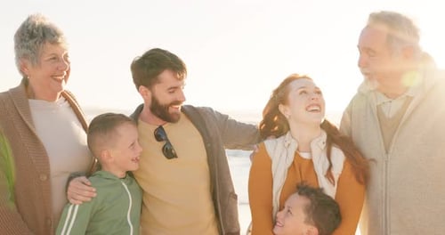 Happy Family Poses Together on a Sunny Beach