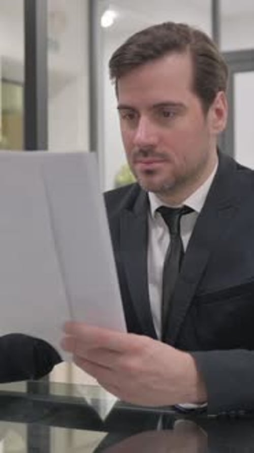 Reading Business Documents in Office, Paperwork, vertical video