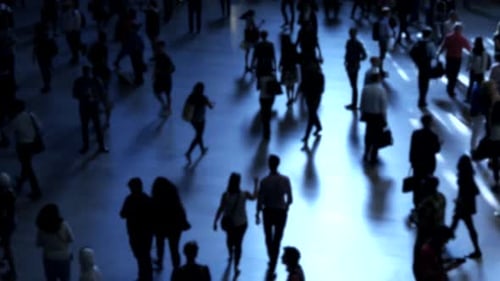 Blurred Crowd of People Walking in Urban Environment