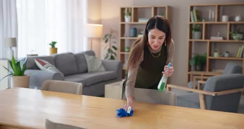 Woman Cleans Table in Bright Home Interior