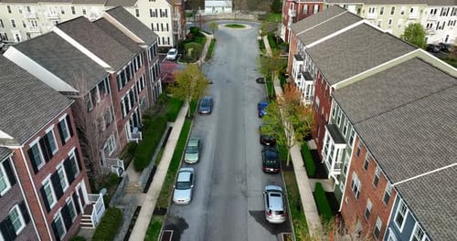 Apartment buildings in America. USA residential rental unit. Cars parked along street in suburban co