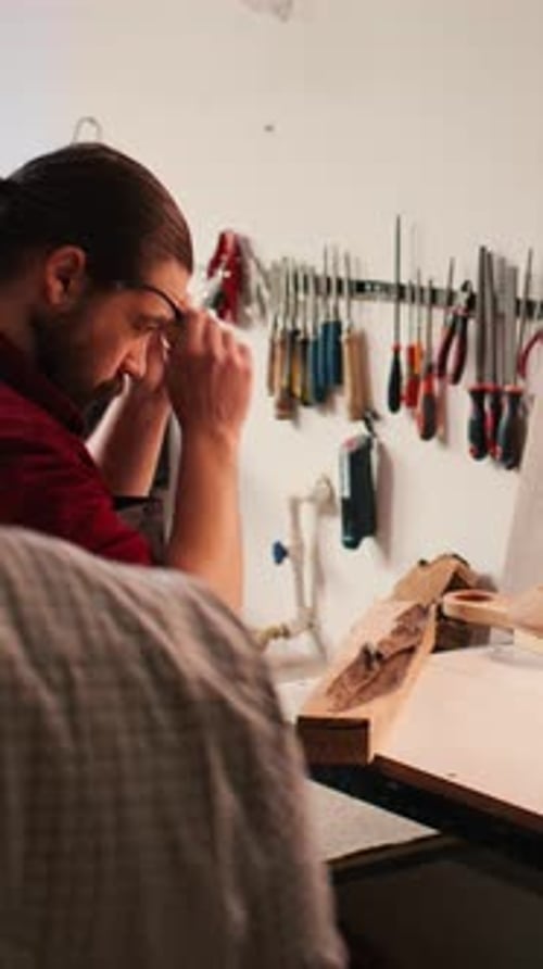 Vertical Video Carpenter Selecting High Quality Wood Material in Assembling Shop