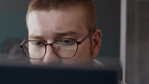 Face Of Young Programmer Closeup