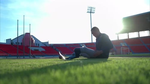 Athletes with disabilities take a break at the stadium between training sessions.
