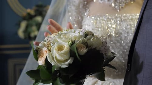 Groom and bride with white roses