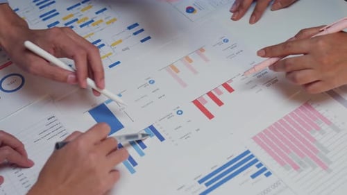 Closeup Asia businesspeople meeting brainstorming new ideas at office night.