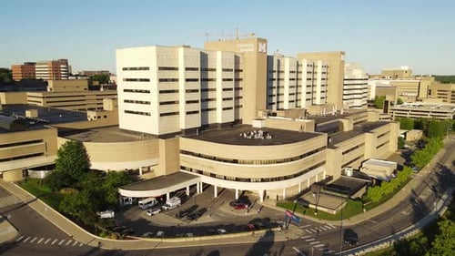 Modern hospital building in Michigan, aerial ascend view